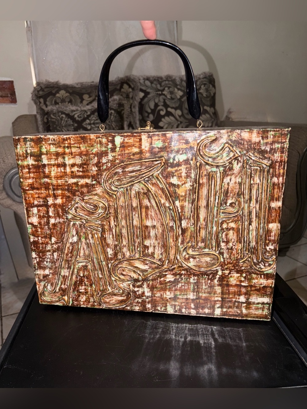 Hard-shell case with a unique, artistic, and handcrafted finish.